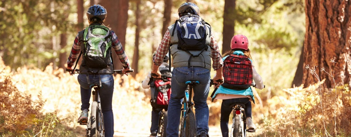 bigstock-Family-mountain-biking-on-fore-123820460-1-1920x1080.jpg
